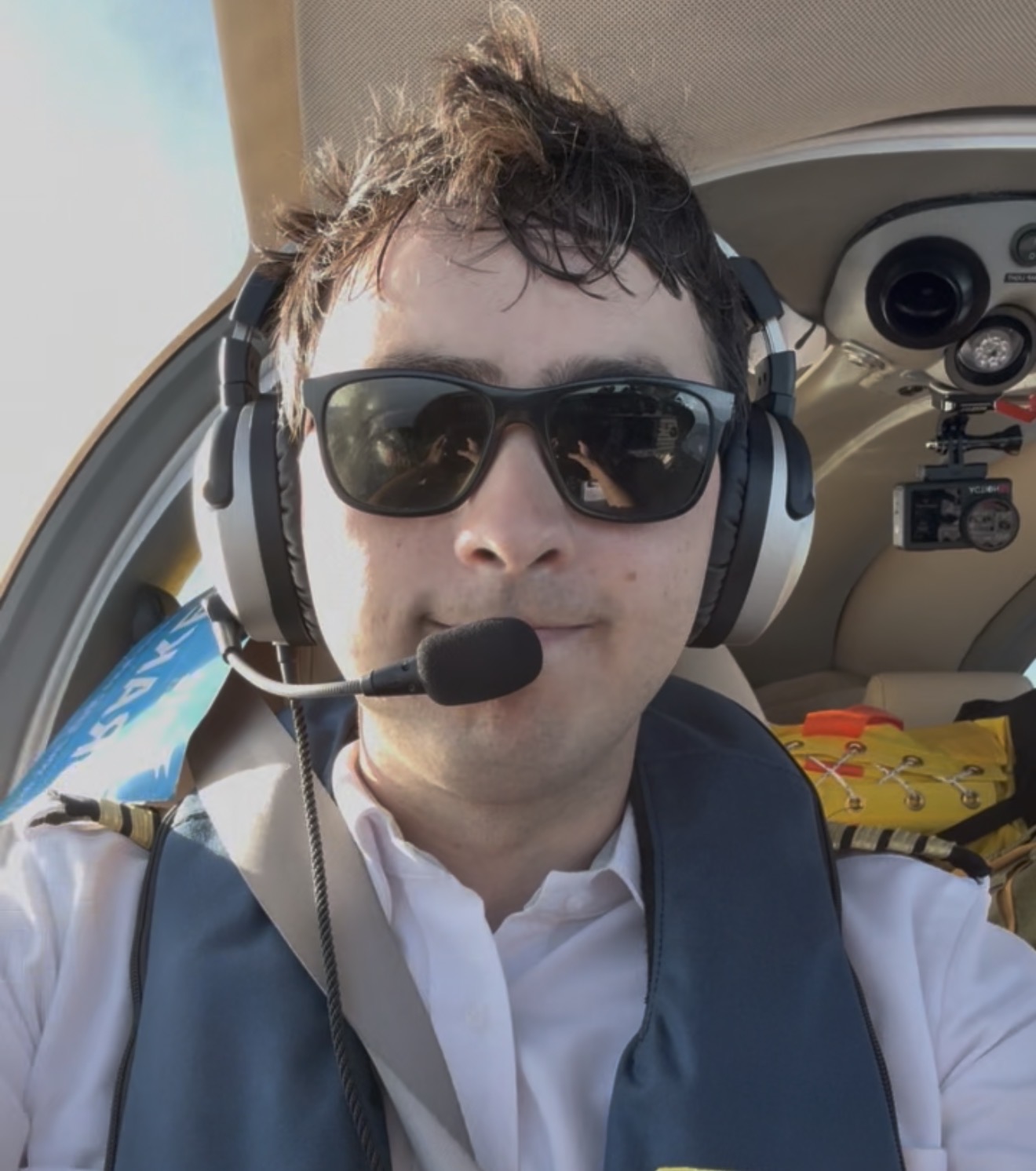 Max wearing a headset in the cockpit